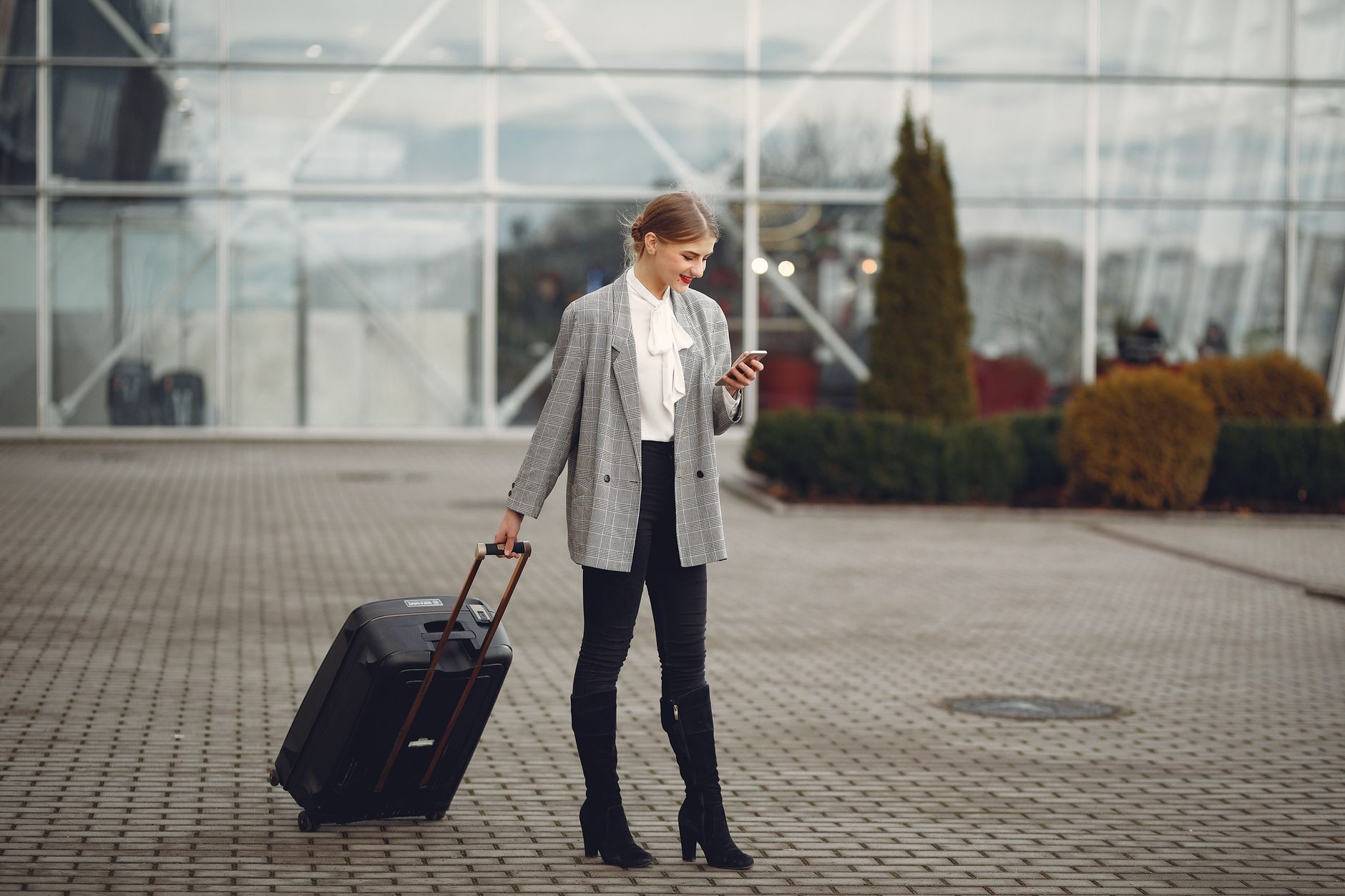 Mobile phone traveler in Qatar airport